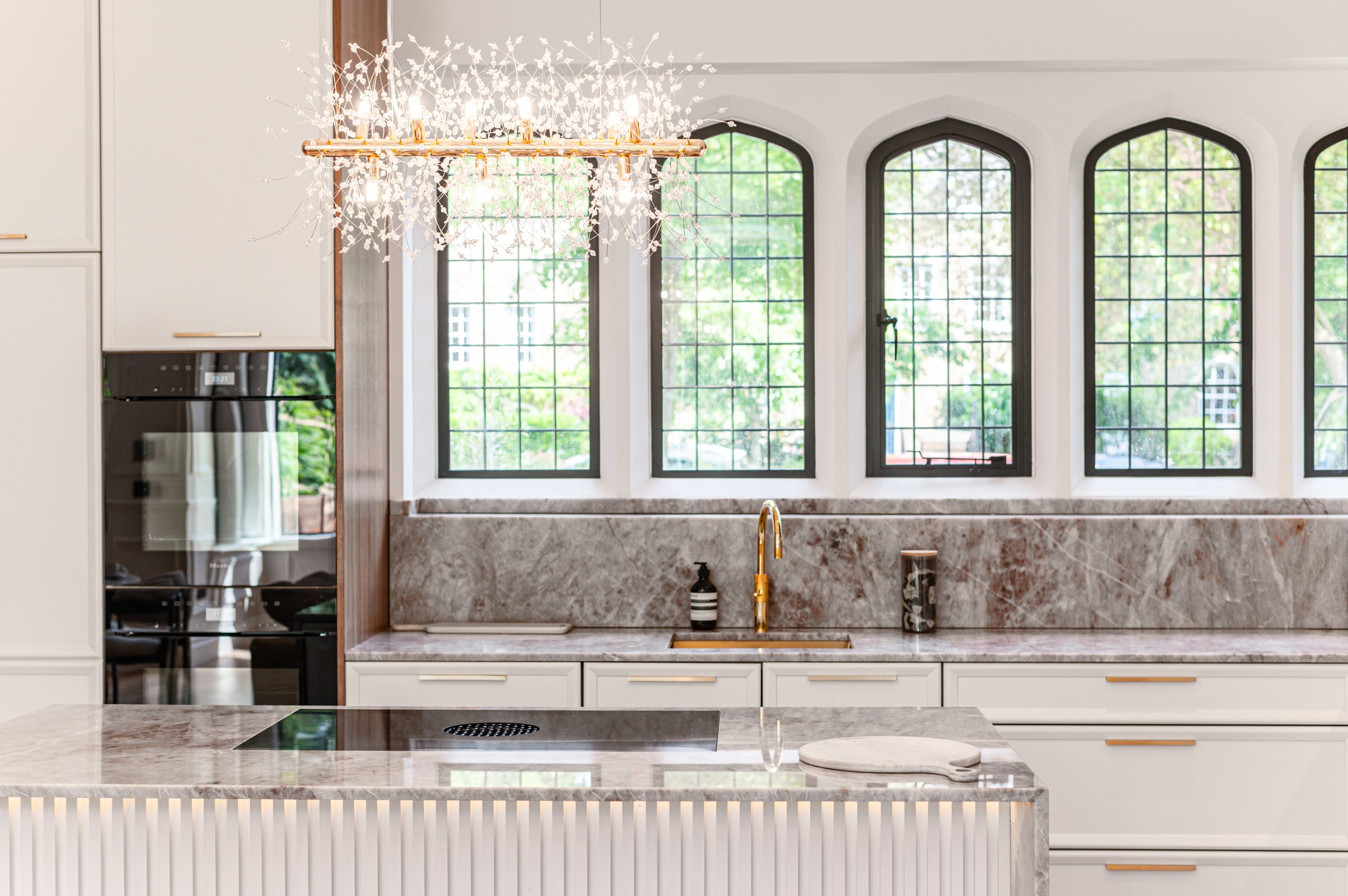 Marble kitchen with arched windows — property photography by CloudCrew Studio